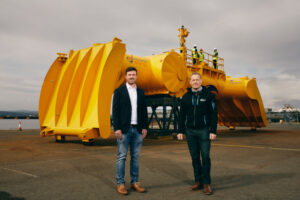 L-R Cameron McNatt, managing director of Mocean Energy and Tim Hurst, managing director of Wave Energy Scotland infront of Mocean Energy’s Blue X wave energy converter at Forth Ports’ Rosyth Docks.